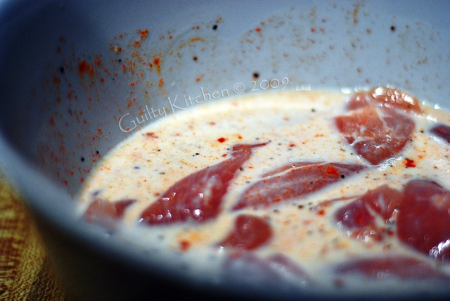 Chicken fillets marinating in buttermilk