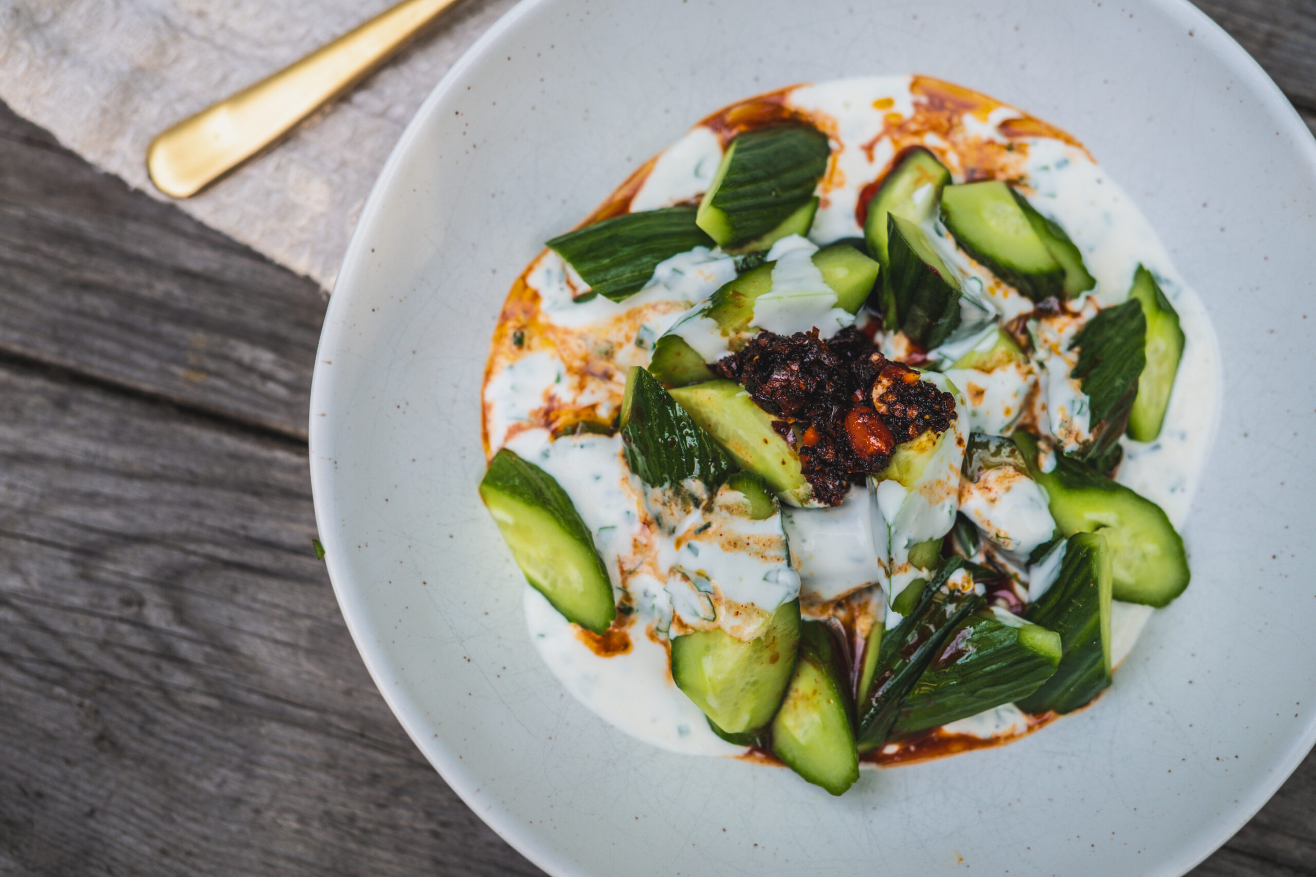 Layered cucumber salad with spicy vinaigrette and crunchy cucumbers
